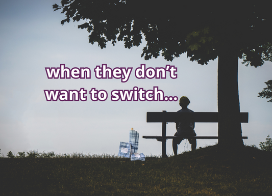 A silhouette of a child sitting on a bench by a tree. I edited it to add a roll of NonPaper Towels on the ground next to the bench. Text reads "when they don't want to switch."