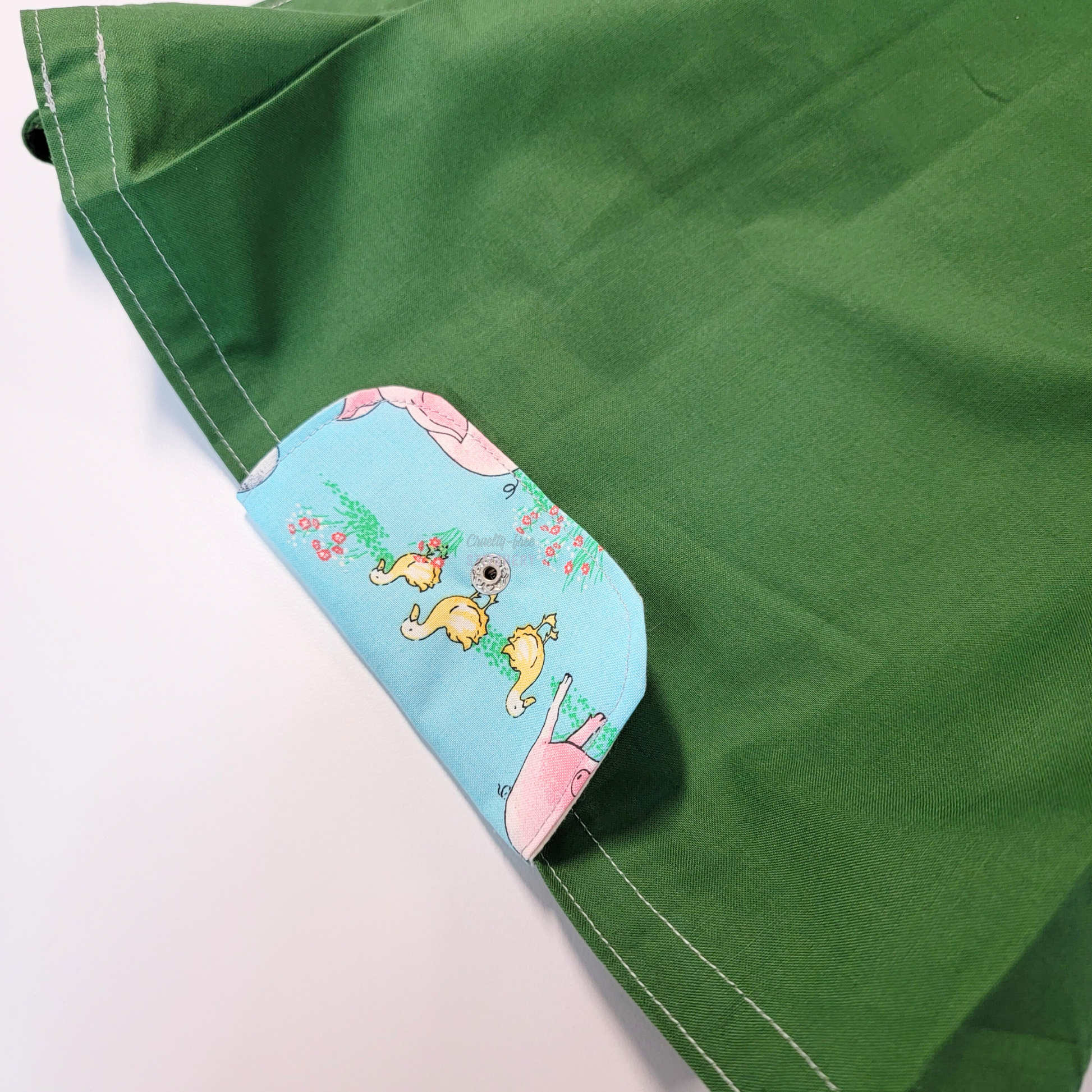 The flap also snaps to the top of the bag to close it while in use.