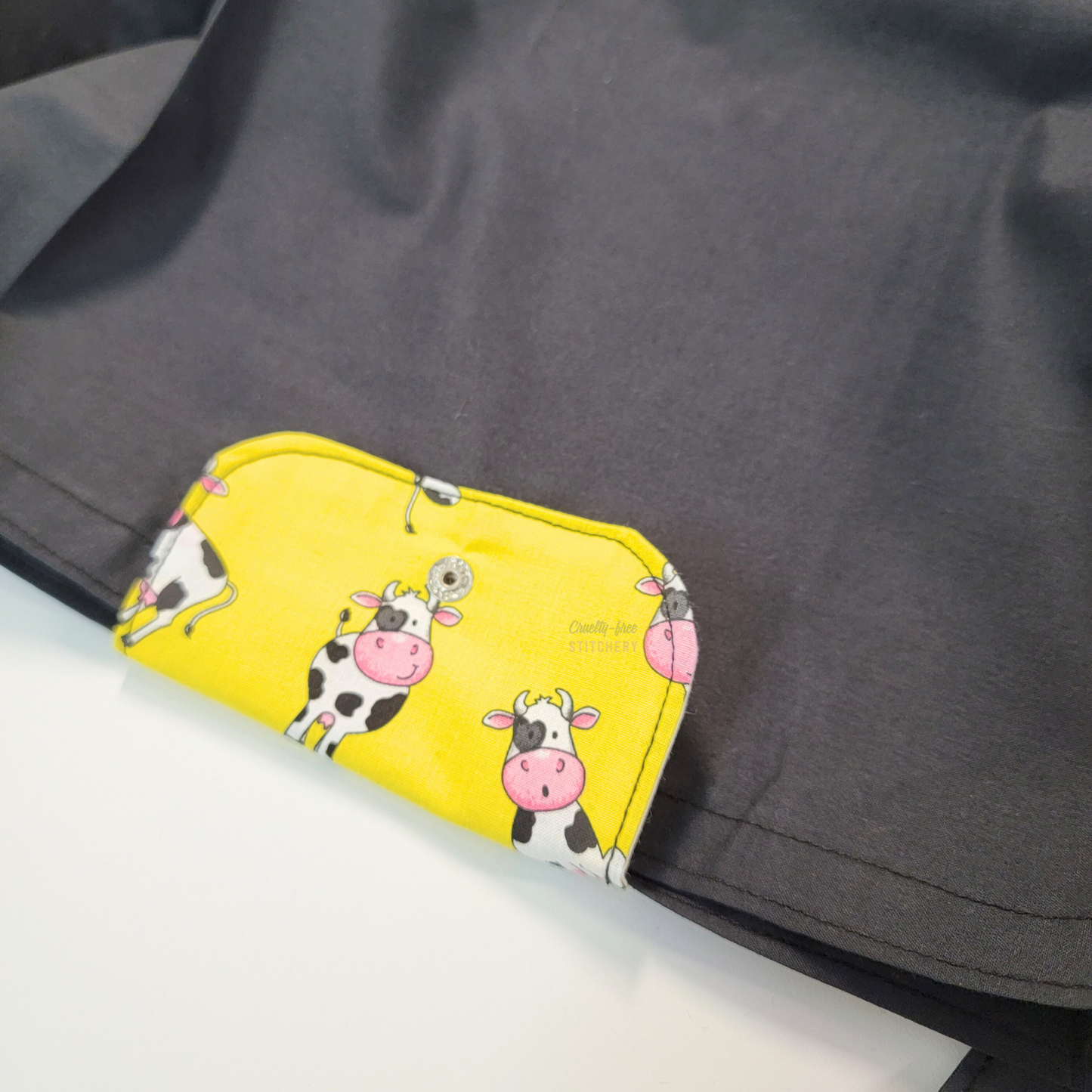 The flap also snaps to the top of the bag to close it while in use.
