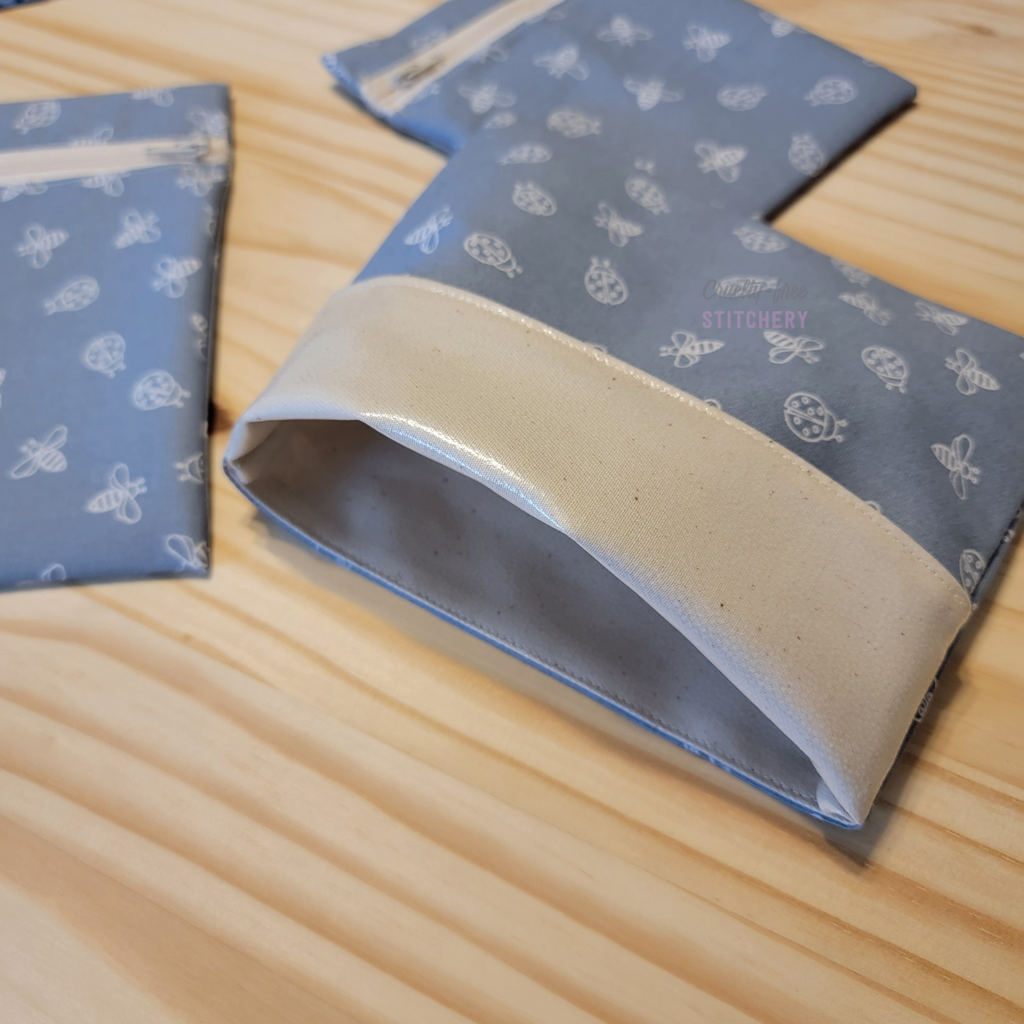 The fold-over snack bag with the top folded back, showing the lining.