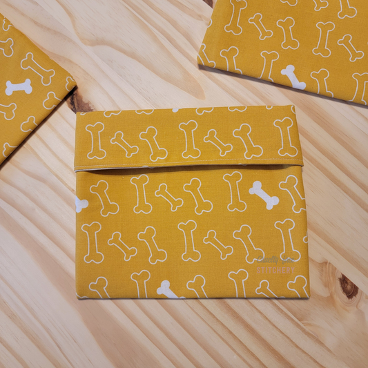The fold-over snack bag in yellow bones print.
