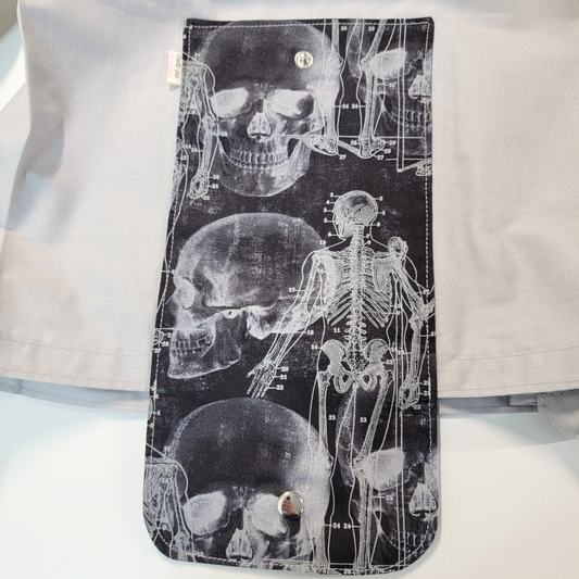 Close-up of the print, the images slightly overlap and the skeleton has numbers pointing to bones, as in a textbook.