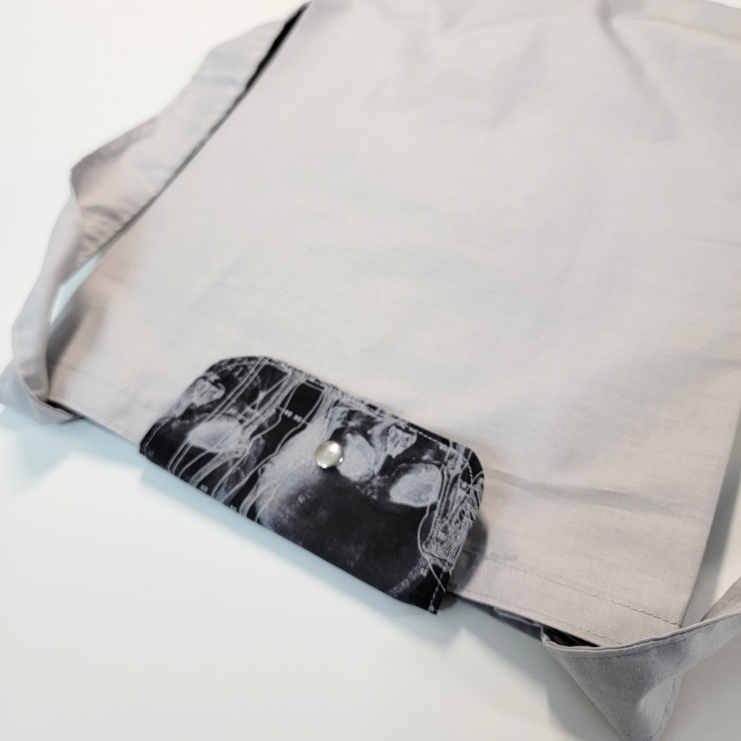 The flap also snaps to the top of the bag to close it while in use.