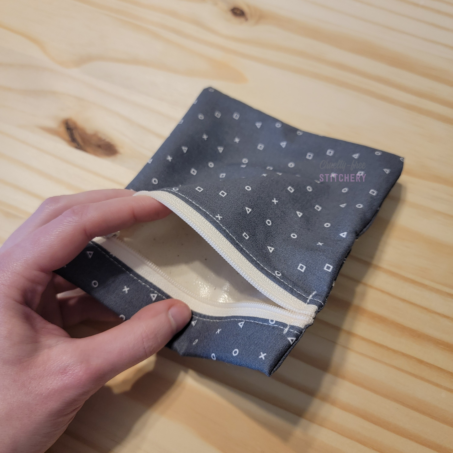 Inside the small zipper snack bag, showing a shiny lining.