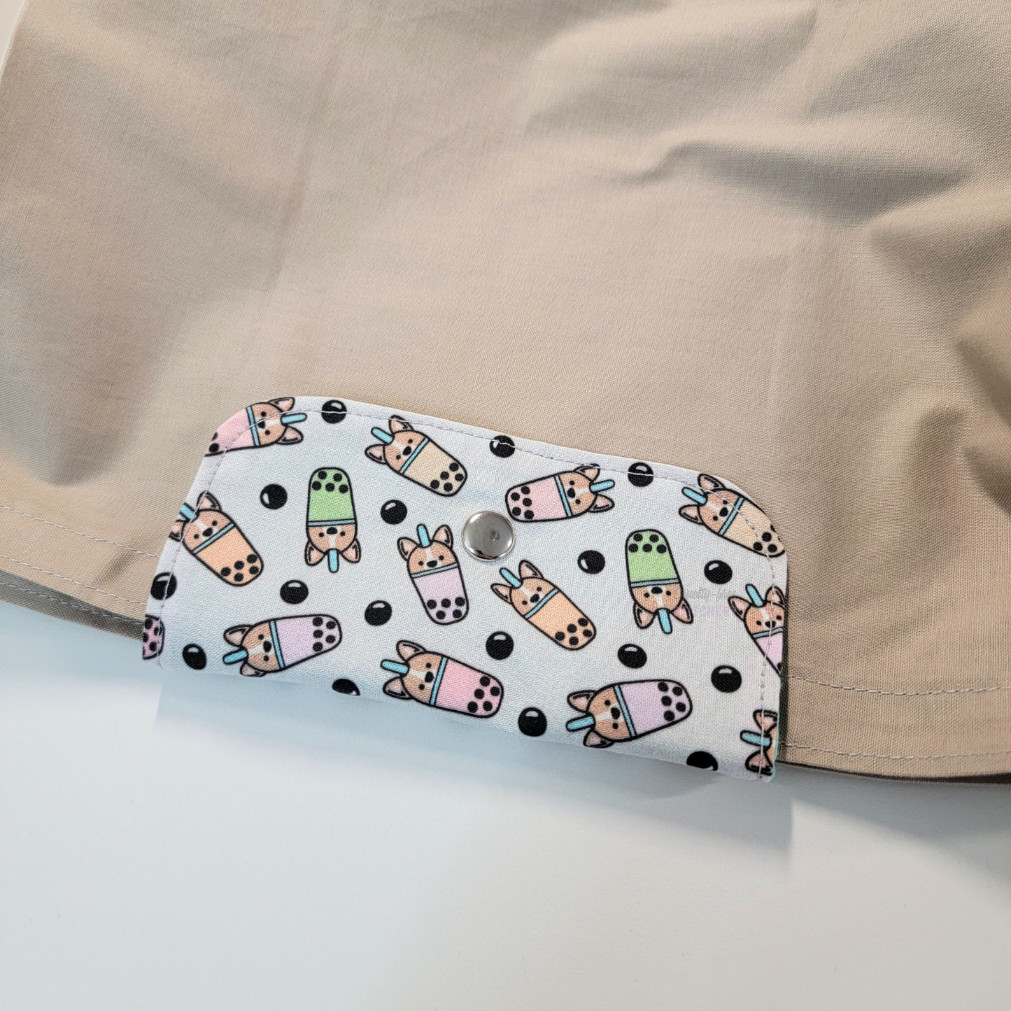 The flap also snaps to the top of the bag to close it while in use.