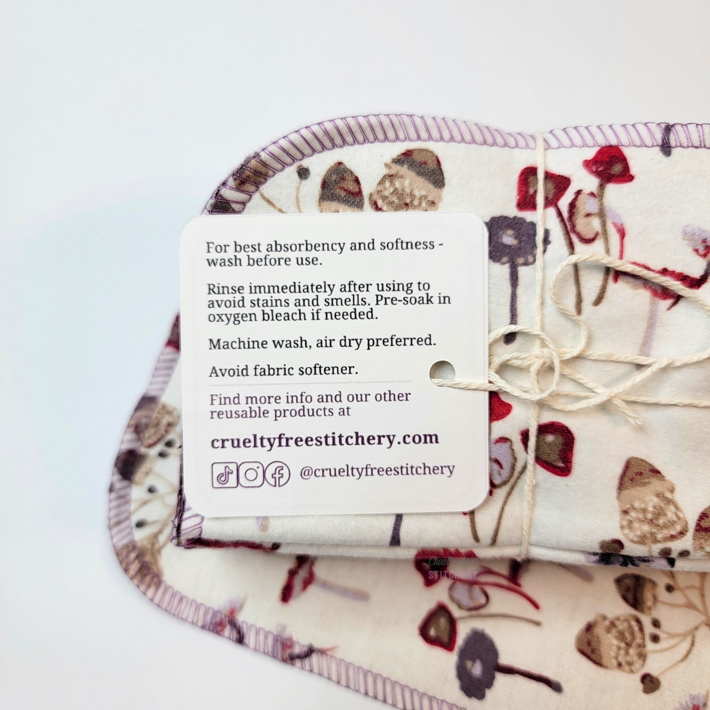 The back of the tag with care instructions and our contact info. Details can be found in the item description.