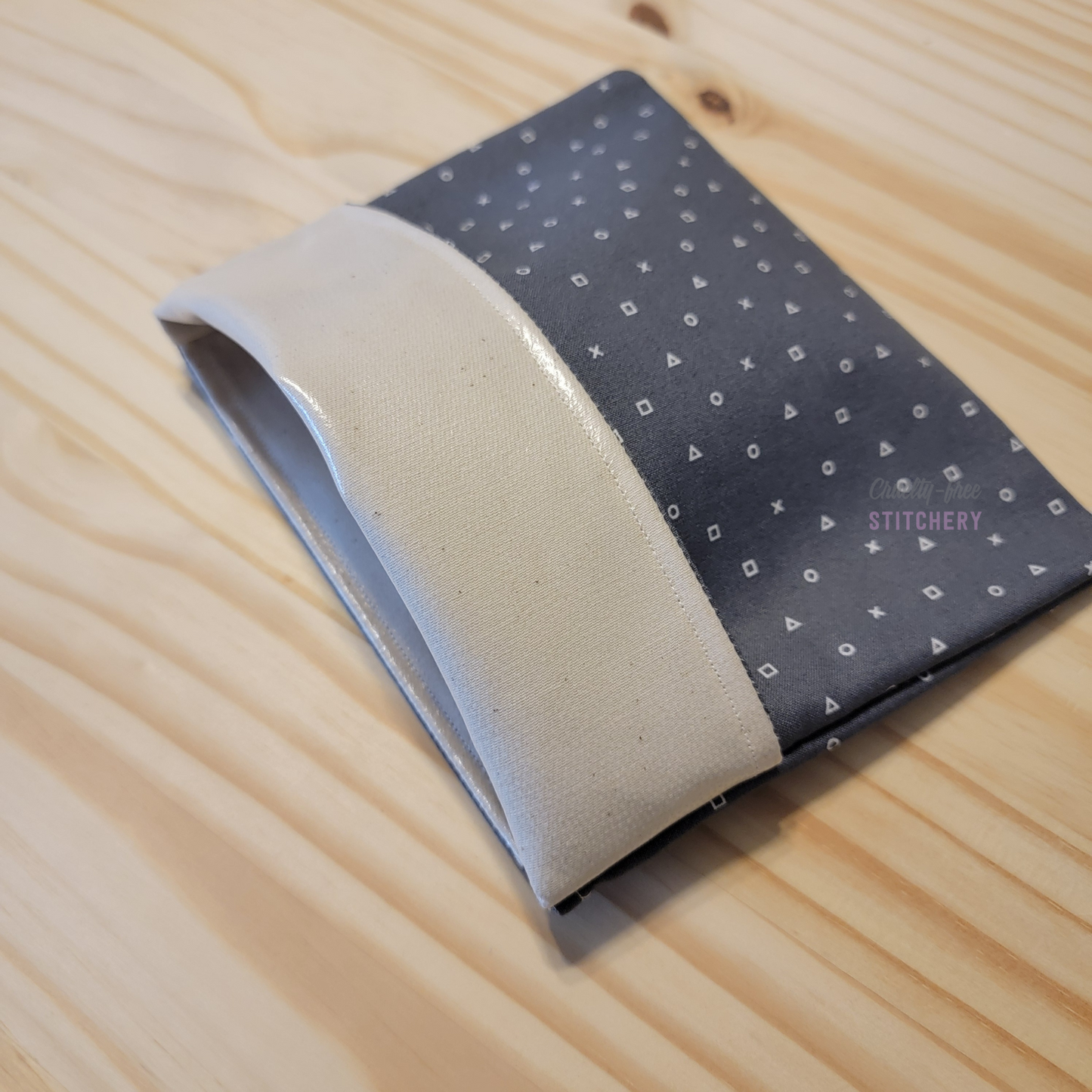 The fold-over snack bag with the top folded back, showing the lining.