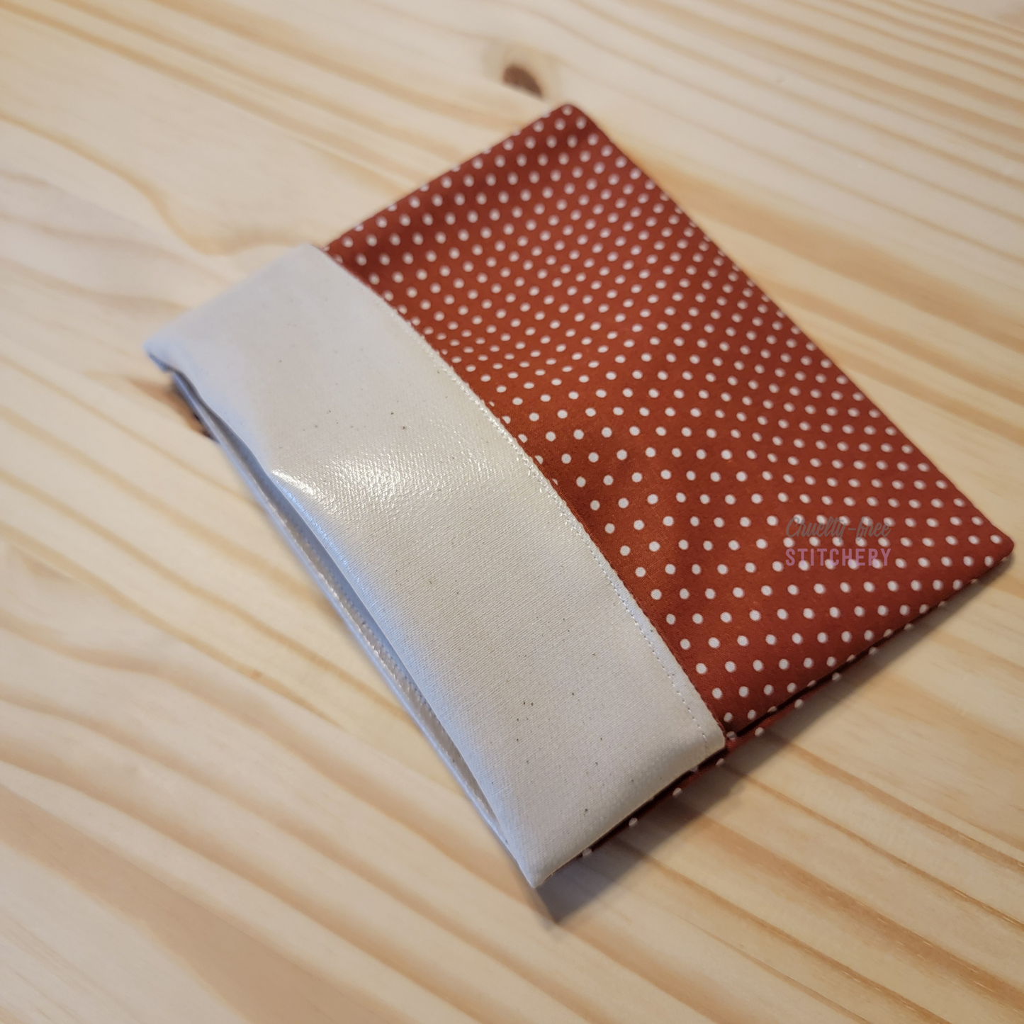 The fold-over snack bag with the top folded back, showing the lining.