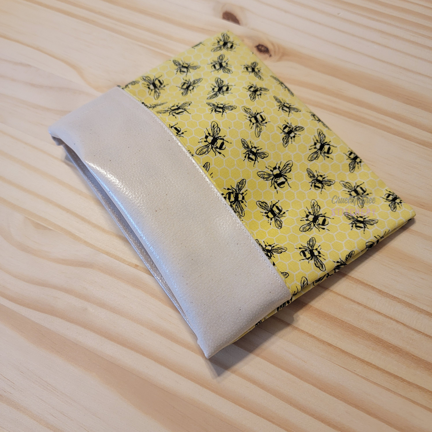 The fold-over snack bag with the top folded back, showing the lining.