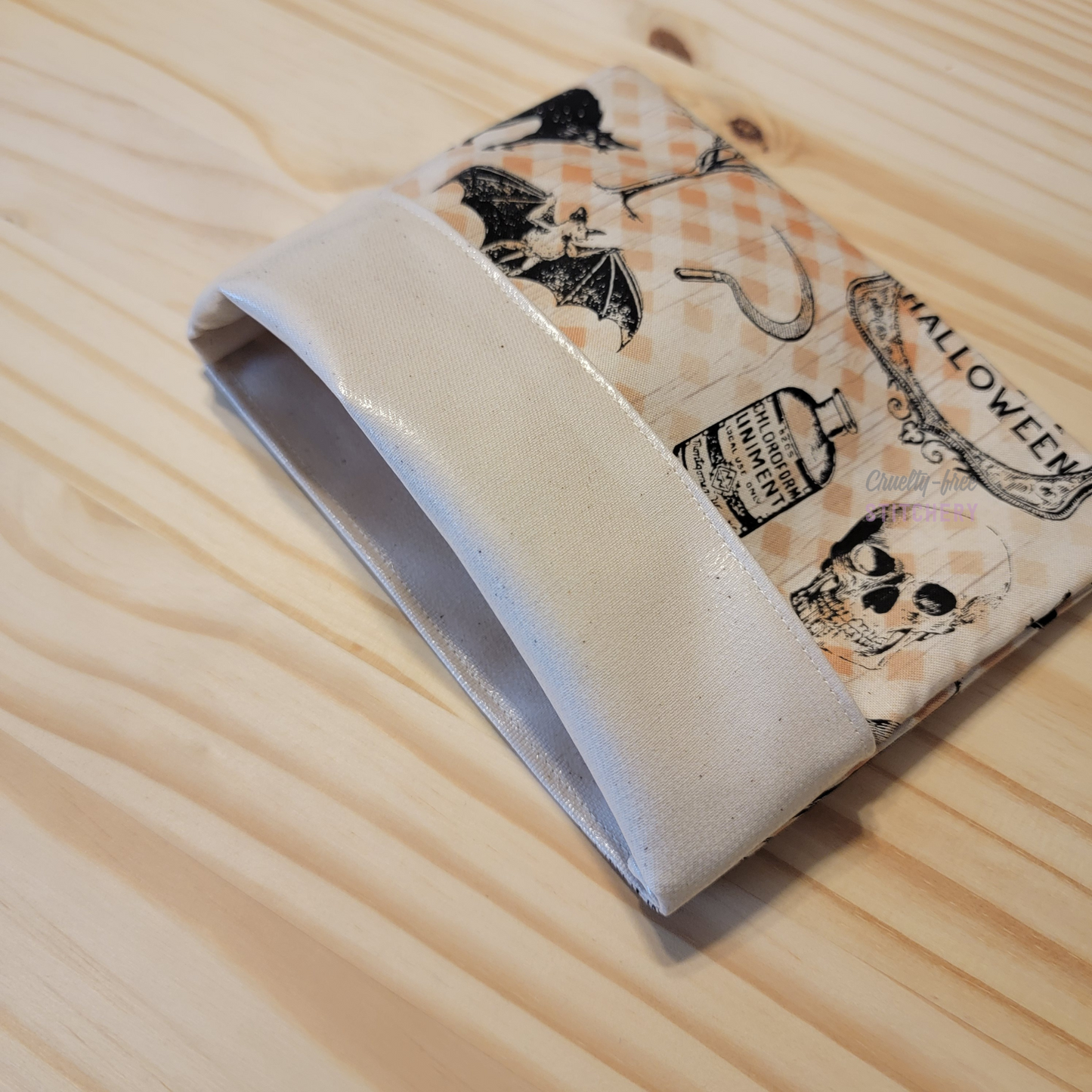The fold-over snack bag with the top folded back, showing the lining.