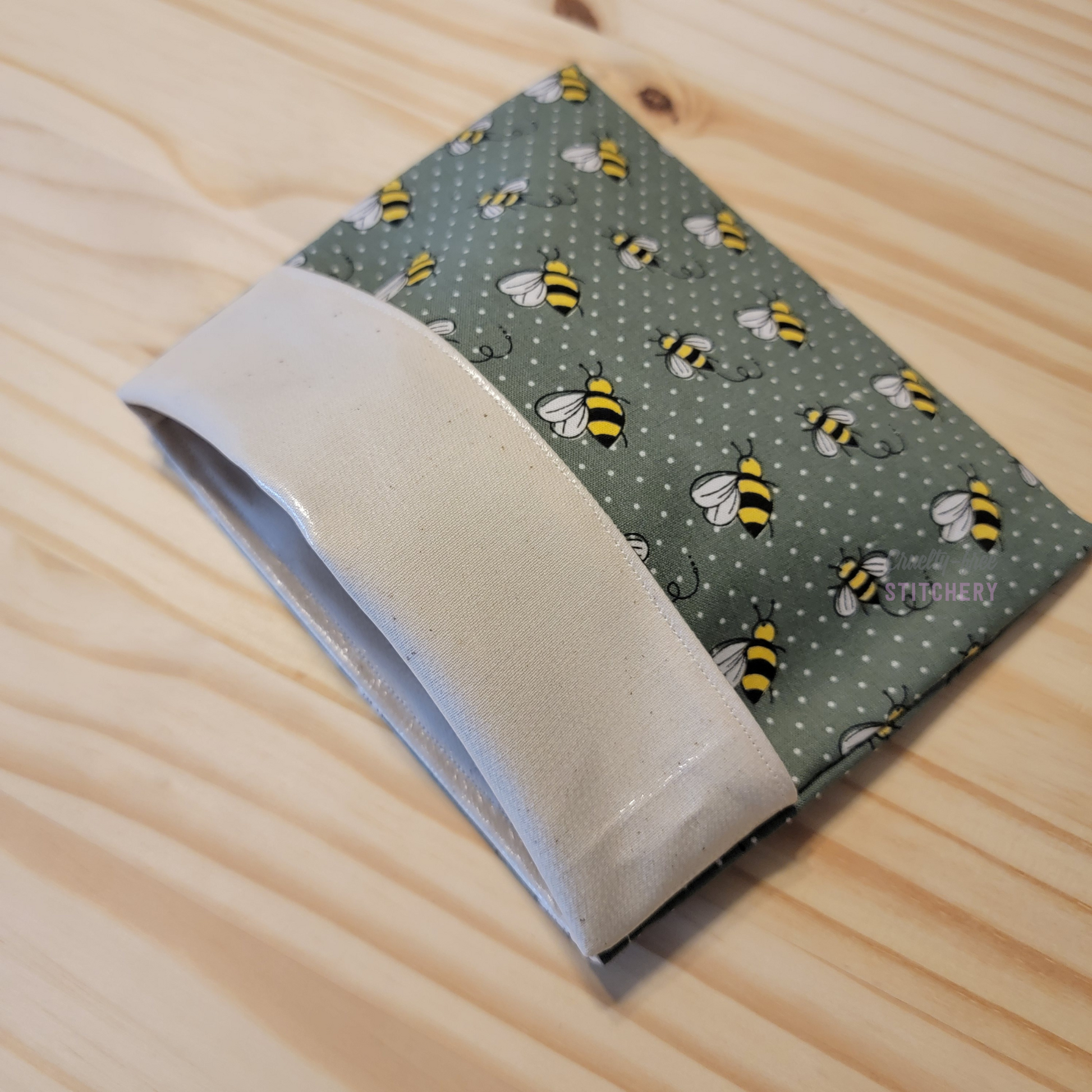 The fold-over snack bag with the top folded back, showing the lining.