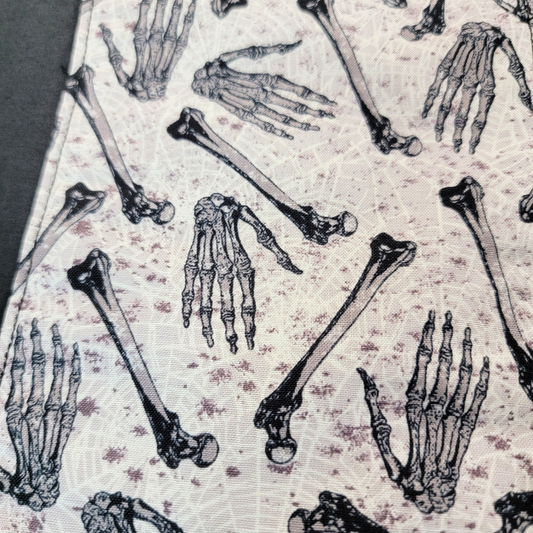 Close-up of the print. The background has a subtle cobweb print and splotches to make it look old.