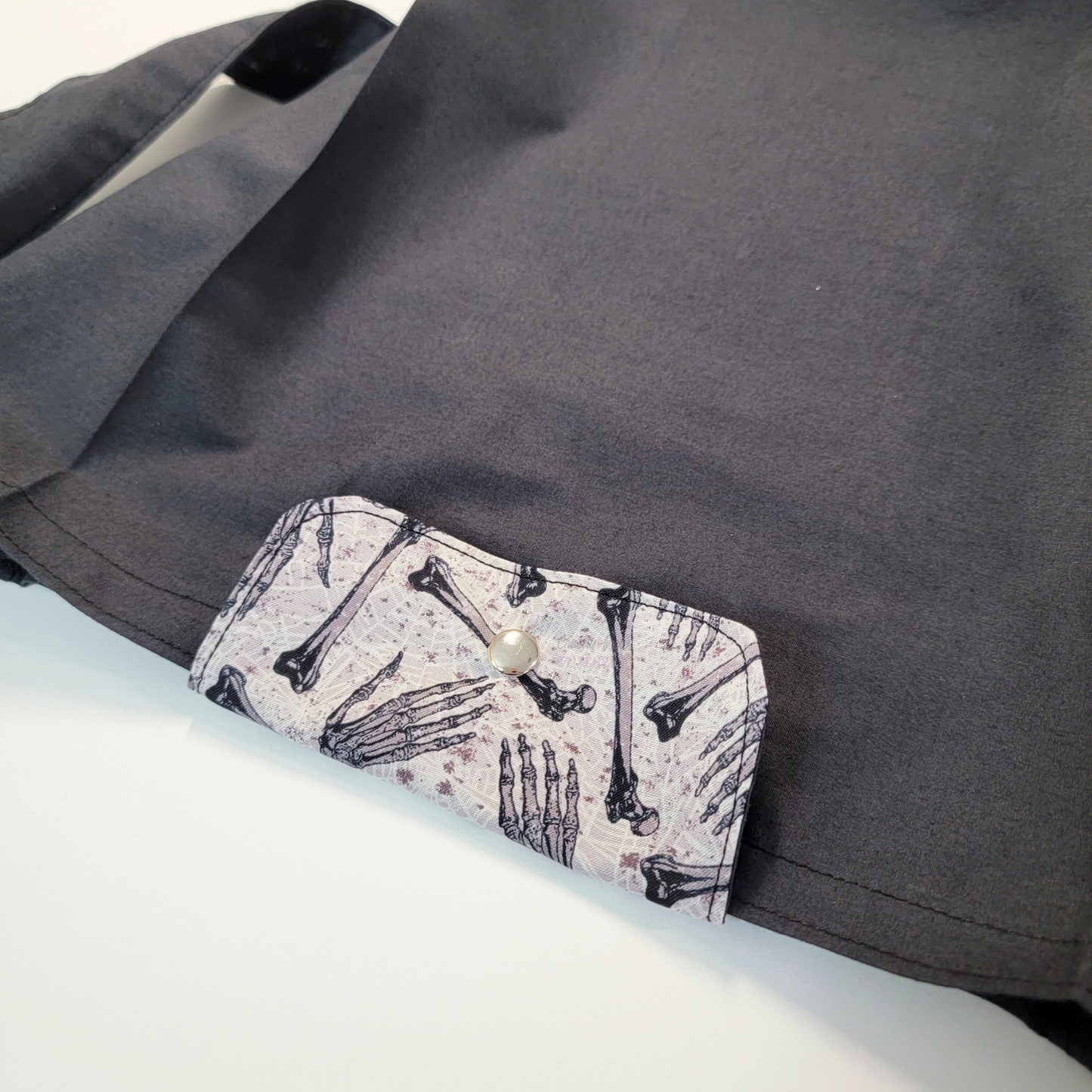 The flap also snaps to the top of the bag to close it while in use.