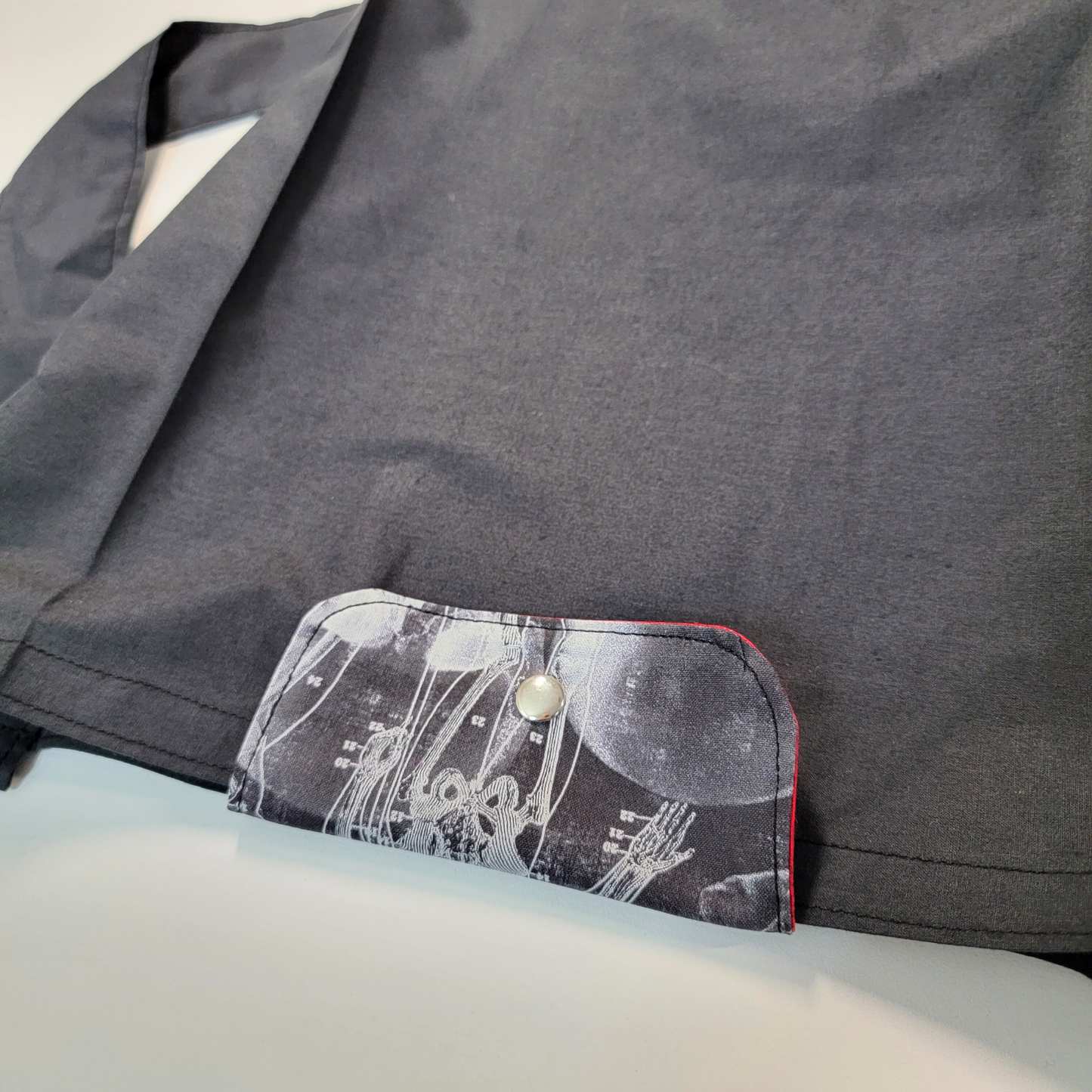 The flap also snaps to the top of the bag to close it while in use.