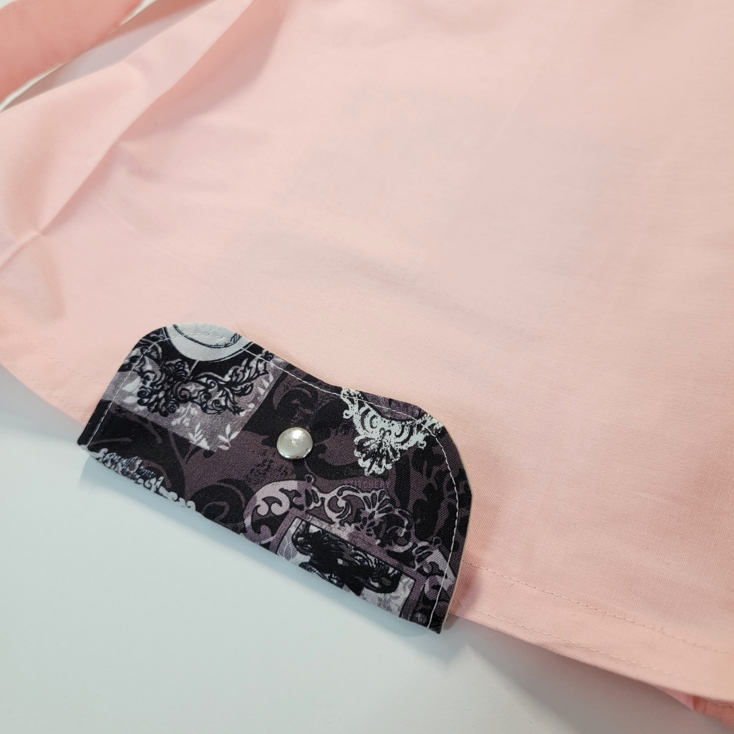 The flap also snaps to the top of the bag to close it while in use.