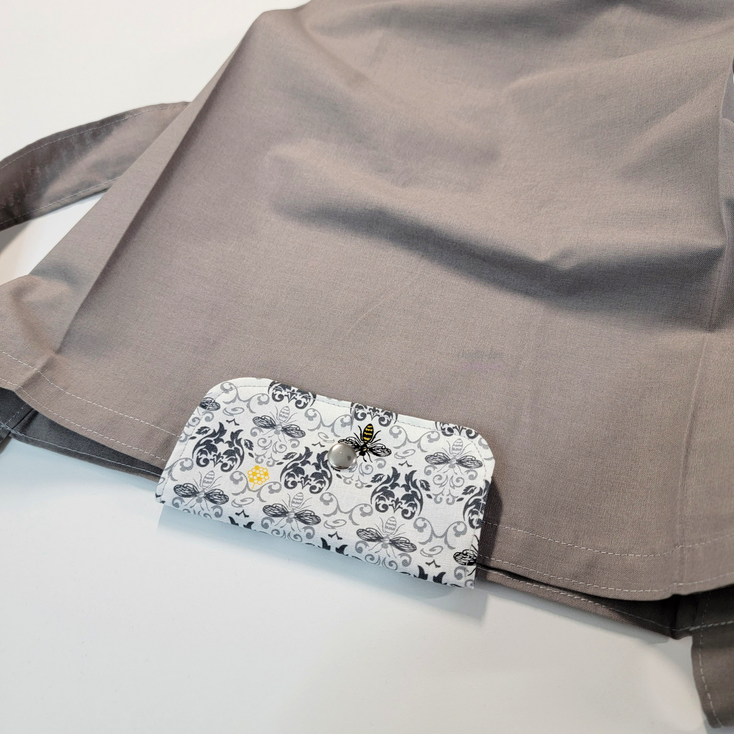 The flap also snaps to the top of the bag to close it while in use.