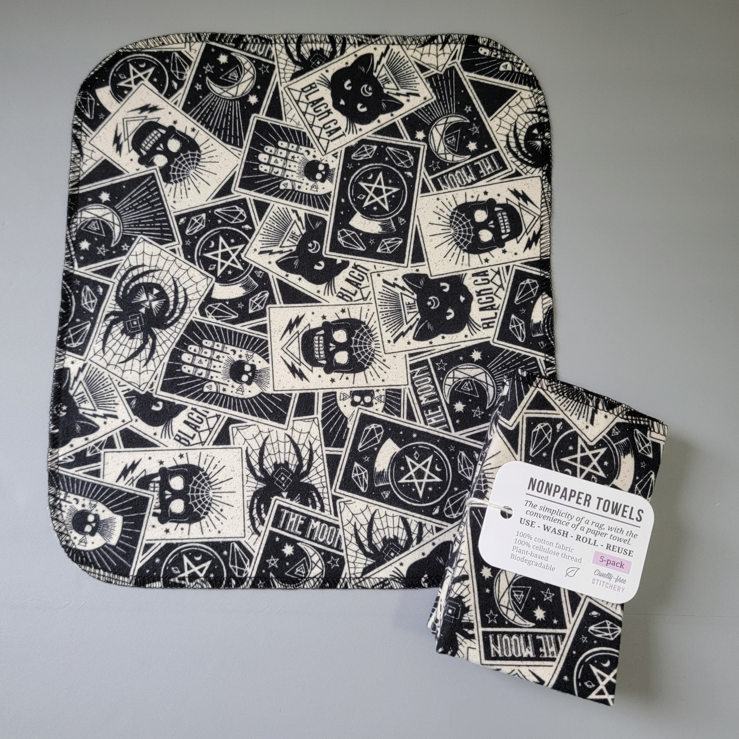 A tarot nonpaper towel laid flat to show the print and shape. The cards are slightly varying sizes but the scale is generally about 2-3 inches tall and 1.5 inches wide.