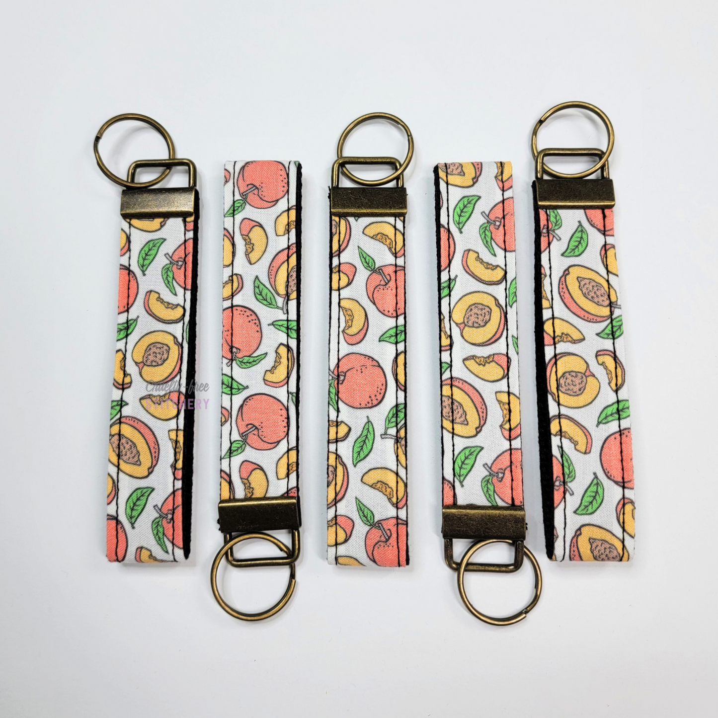 Wristlets arranged in a row to show each may be slightly different due to placement of the fabric.