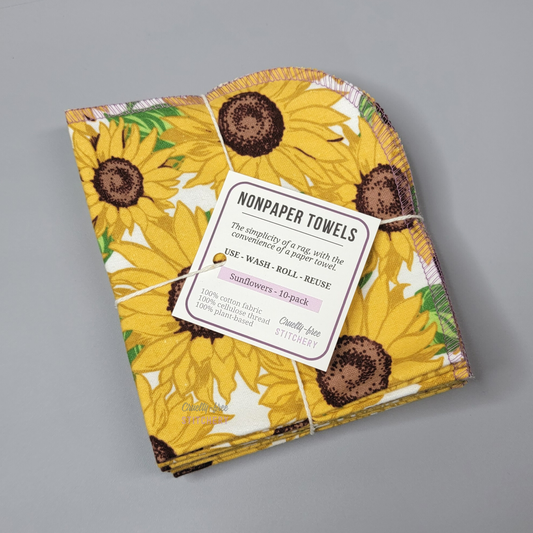 A bundled pack of sunflower NonPaper Towels. Tied with a cotton string and a small white tag.
