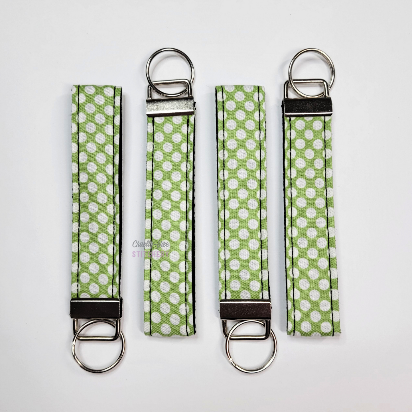Wristlets arranged in a row to show each may be slightly different due to placement of the fabric.