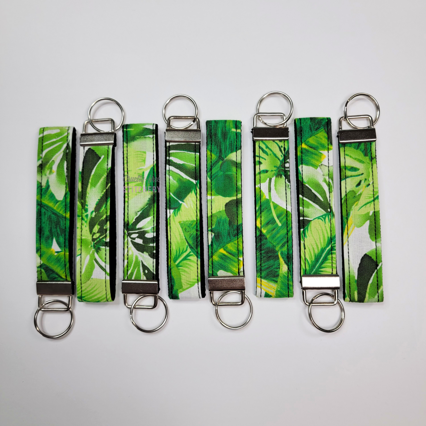 Wristlets arranged in a row to show each may be slightly different due to placement of the fabric.