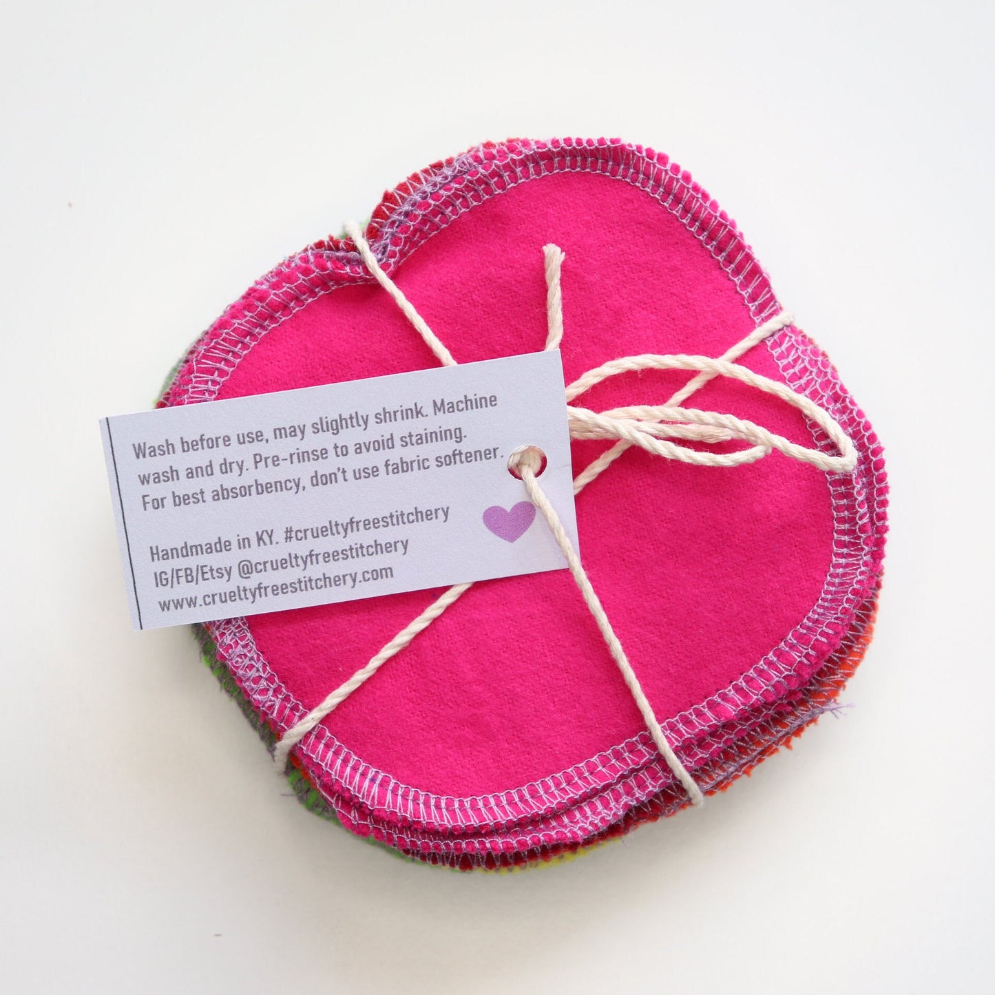 The back of the small paper tag with care instructions.