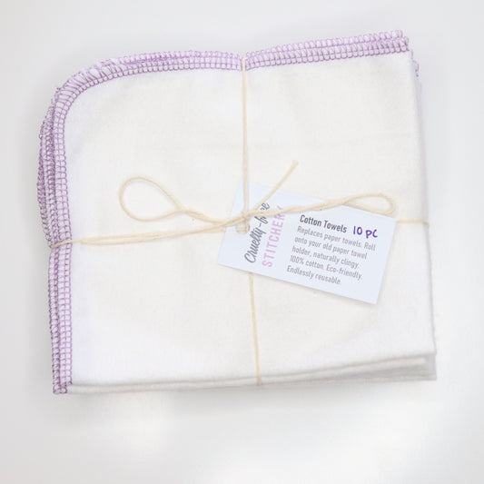 Folded and bundled pack of white NonPaper Towels, tied with string and a small white tag.