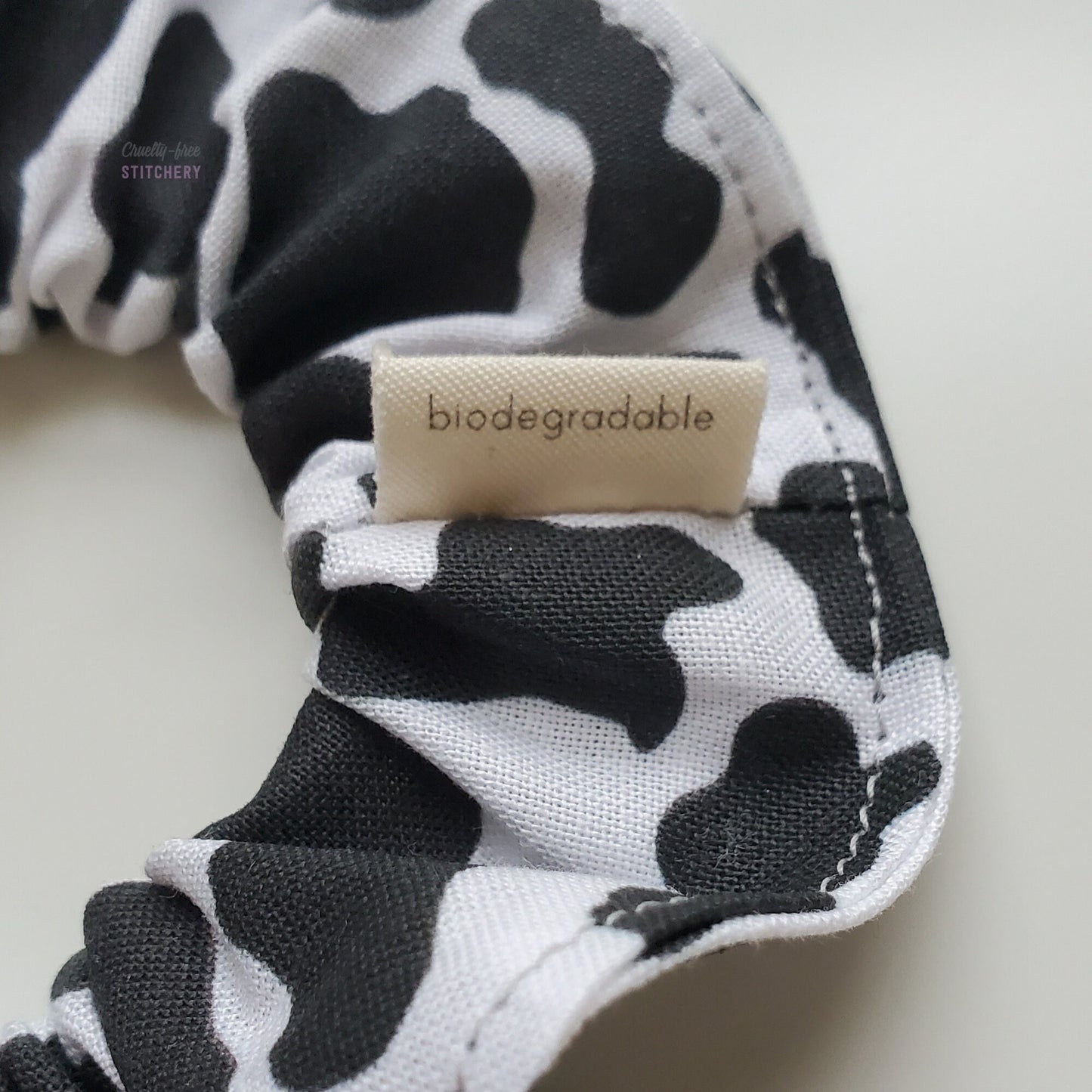 The back of the small white tag says "biodegradable"