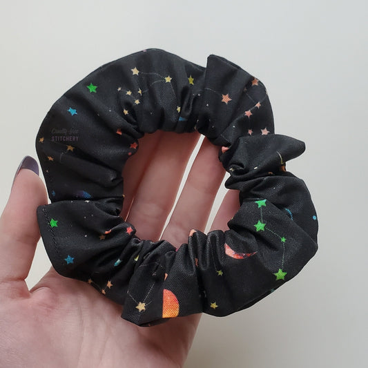 Rainbow stars scrunchie in my hand.