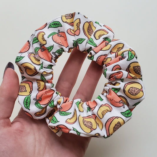 Peaches print scrunchie in my hand.