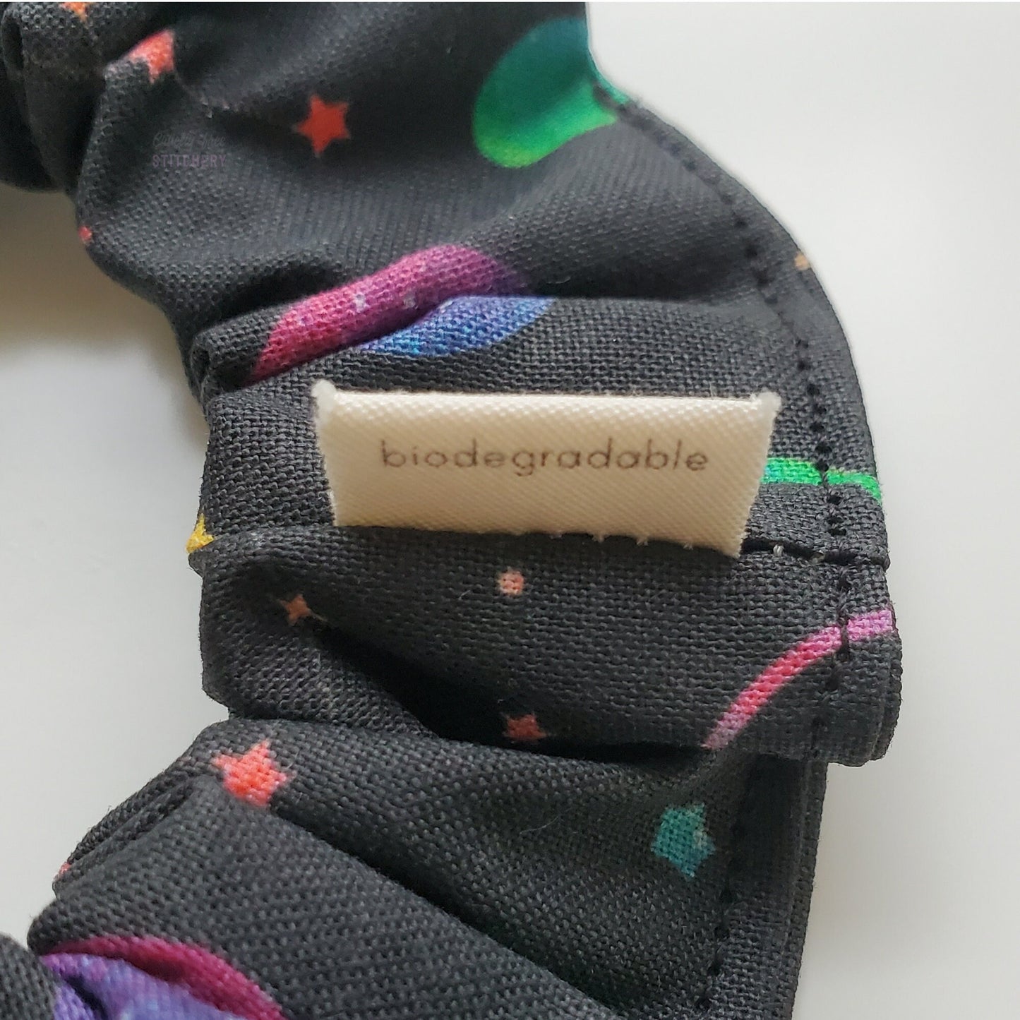 The back of the small white tag says "biodegradable"