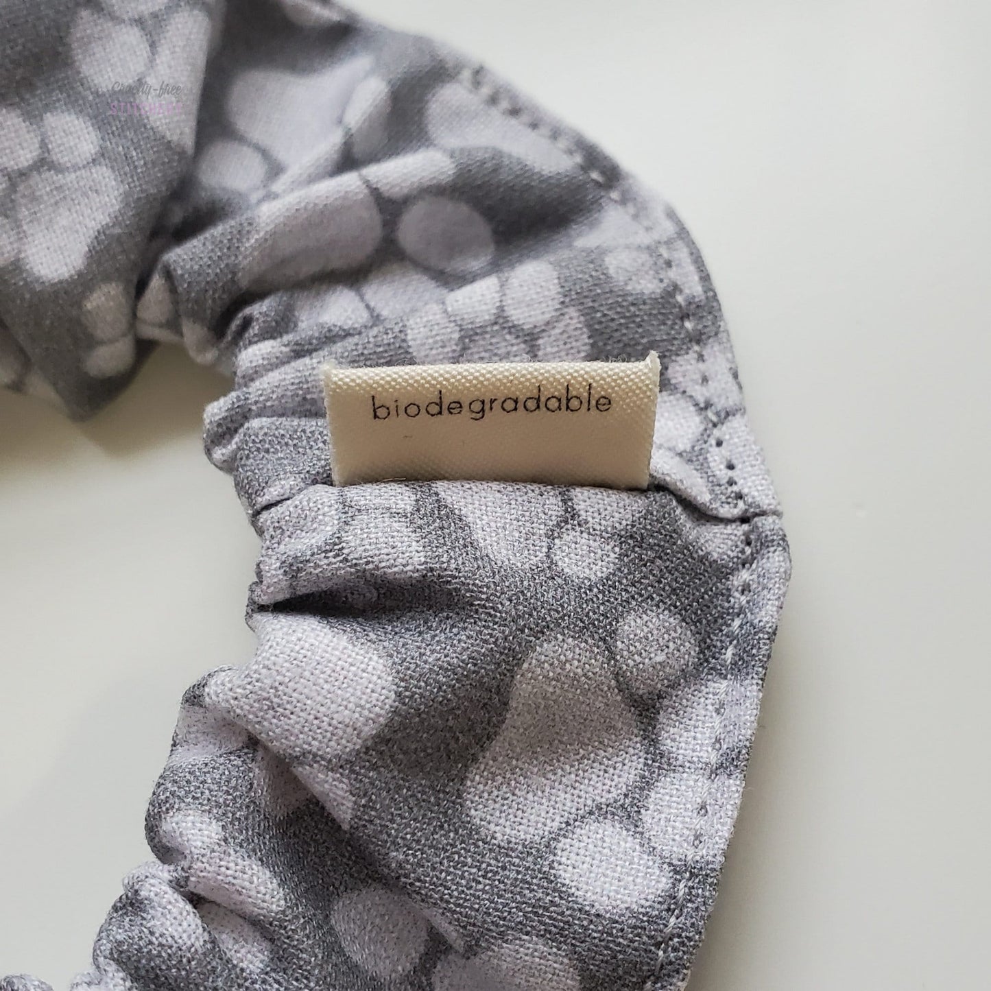 The back of the small white tag says "biodegradable"