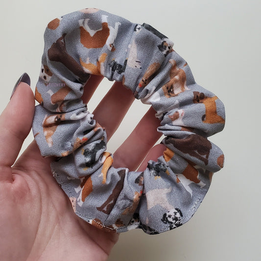Grey with dogs print scrunchie in my hand.