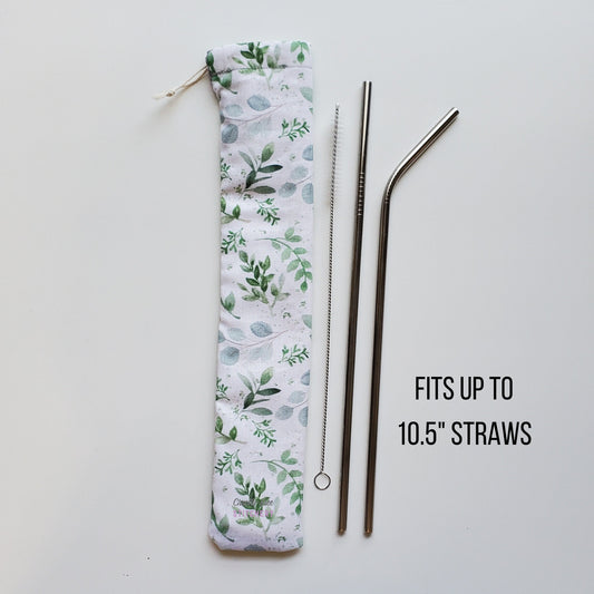 Reusable straw pouch in the same eucalyptus print laying vertically next to a straw cleaner brush, a straight stainless steel straw, and a bent stainless steel straw. Text reads "fits up to 10.5 inch straws"