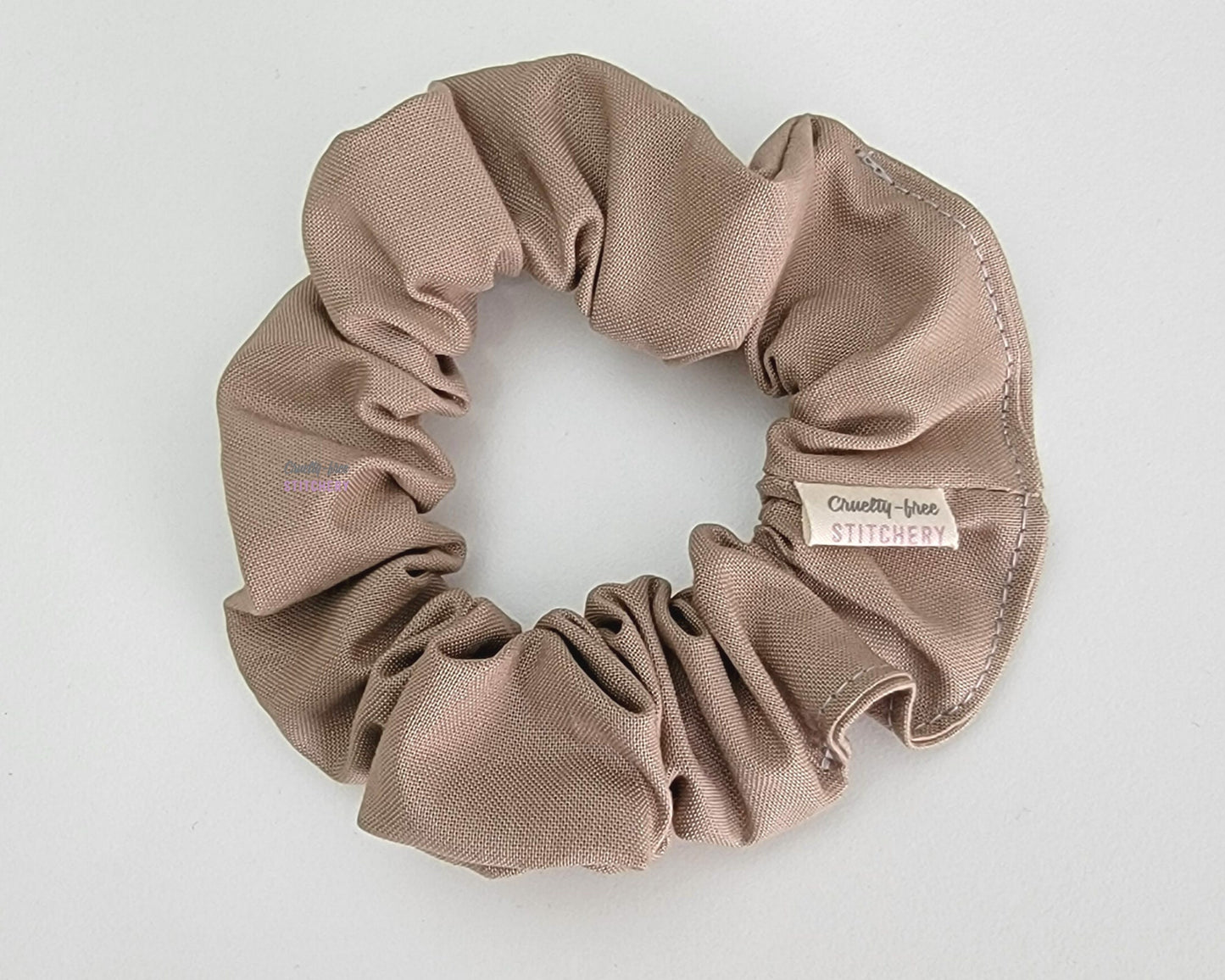 Solid light tan scrunchie.