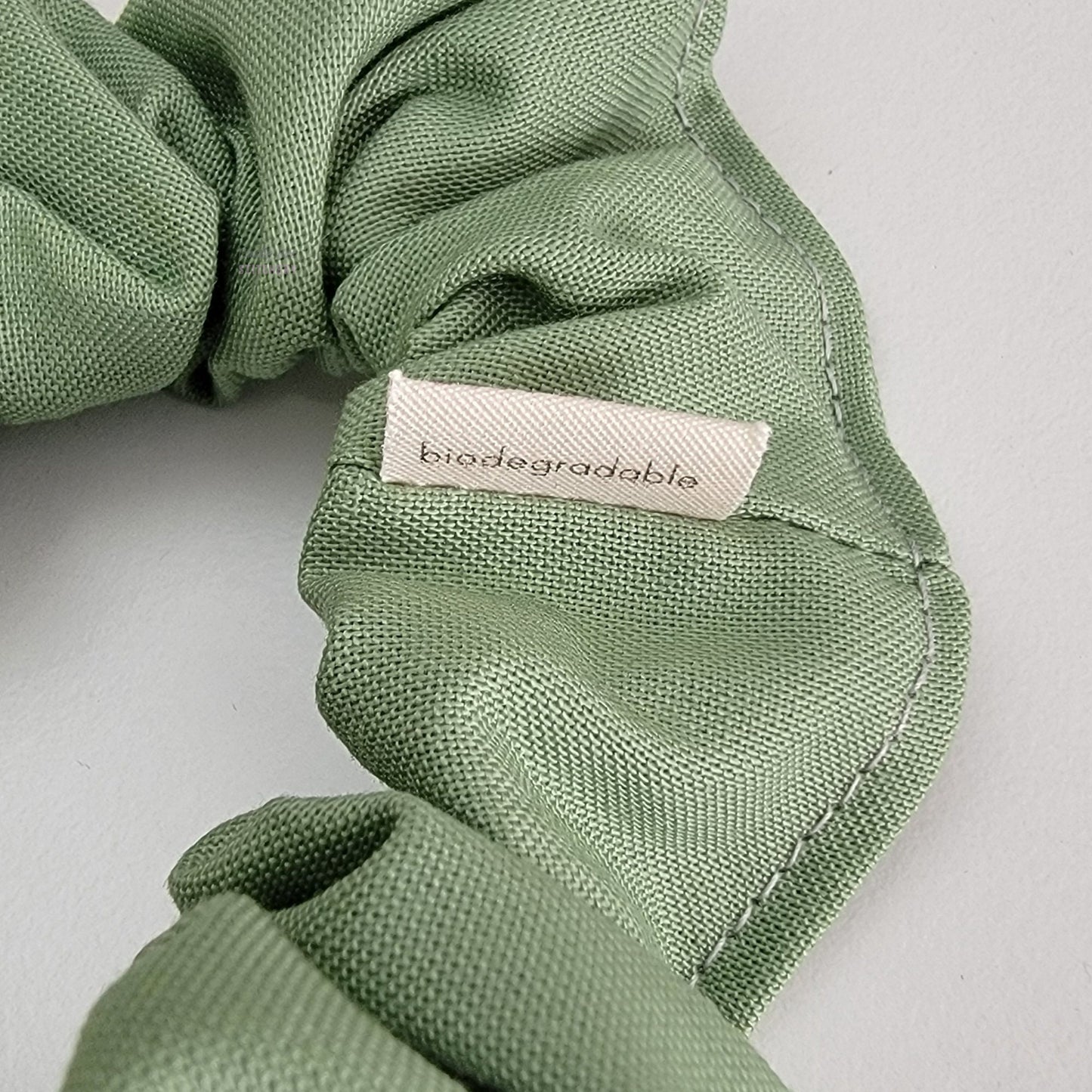 The back of the small white tag says "biodegradable"