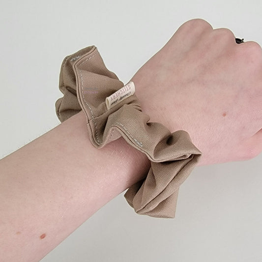 Light tan scrunchie on my arm.