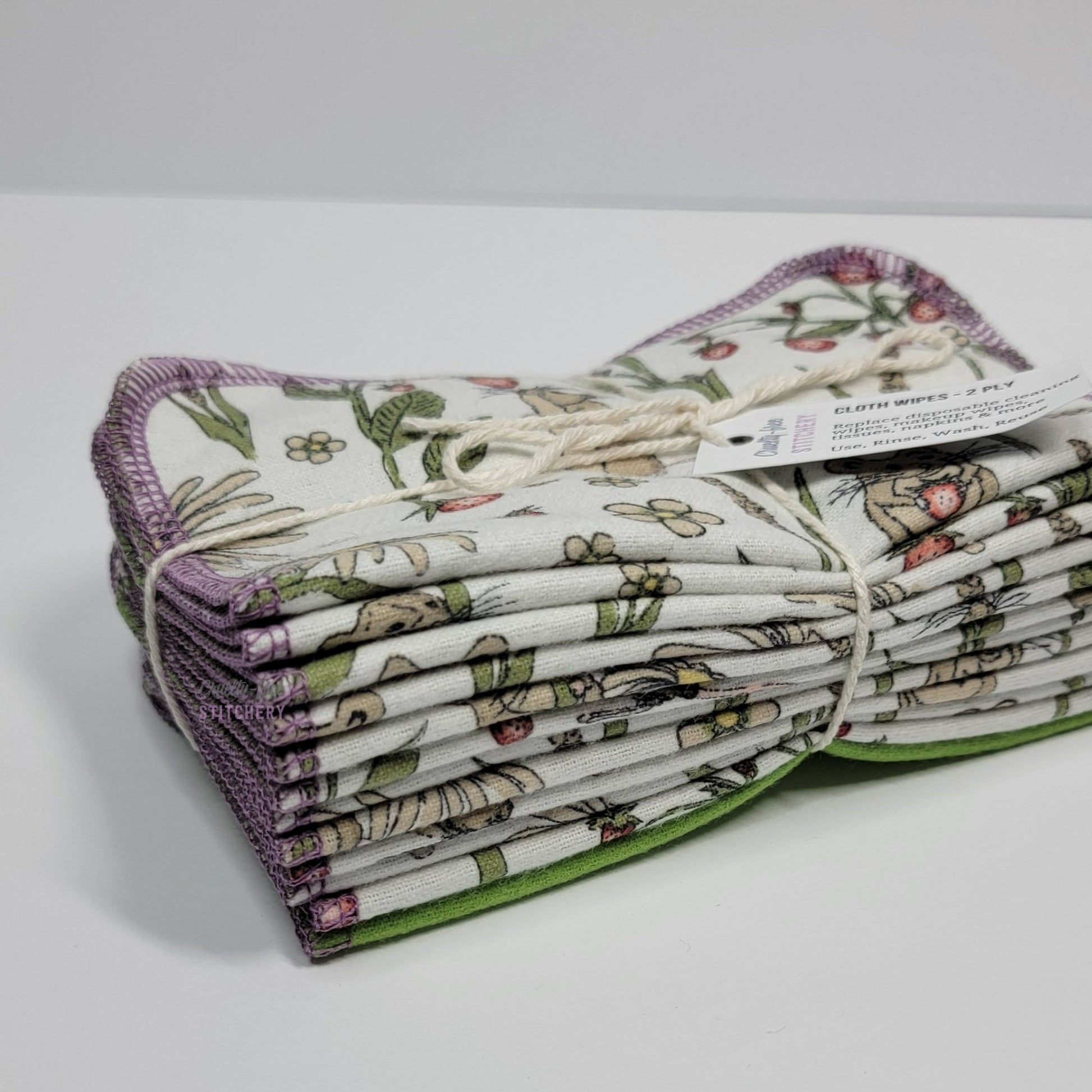 A bundled pack of the Mouse print Cloth Wipes, pictured from the bottom to show that there are twelve wipes.