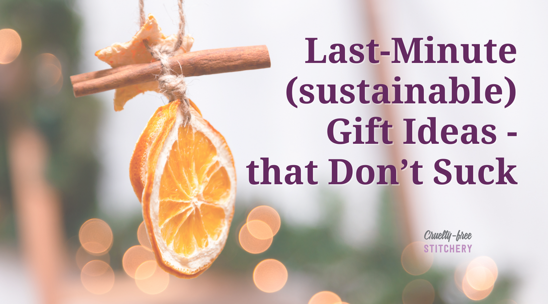 Last-minute sustainable gift ideas that don't suck. Purple text with an image of a dried orange and cinnamon stick Christmas ornament, with a blurry tree and lights in the background.