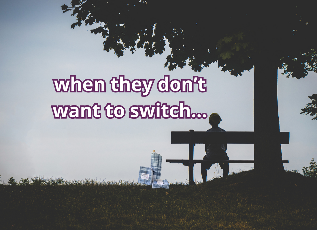 A silhouette of a child sitting on a bench by a tree. I edited it to add a roll of NonPaper Towels on the ground next to the bench. Text reads "when they don't want to switch."