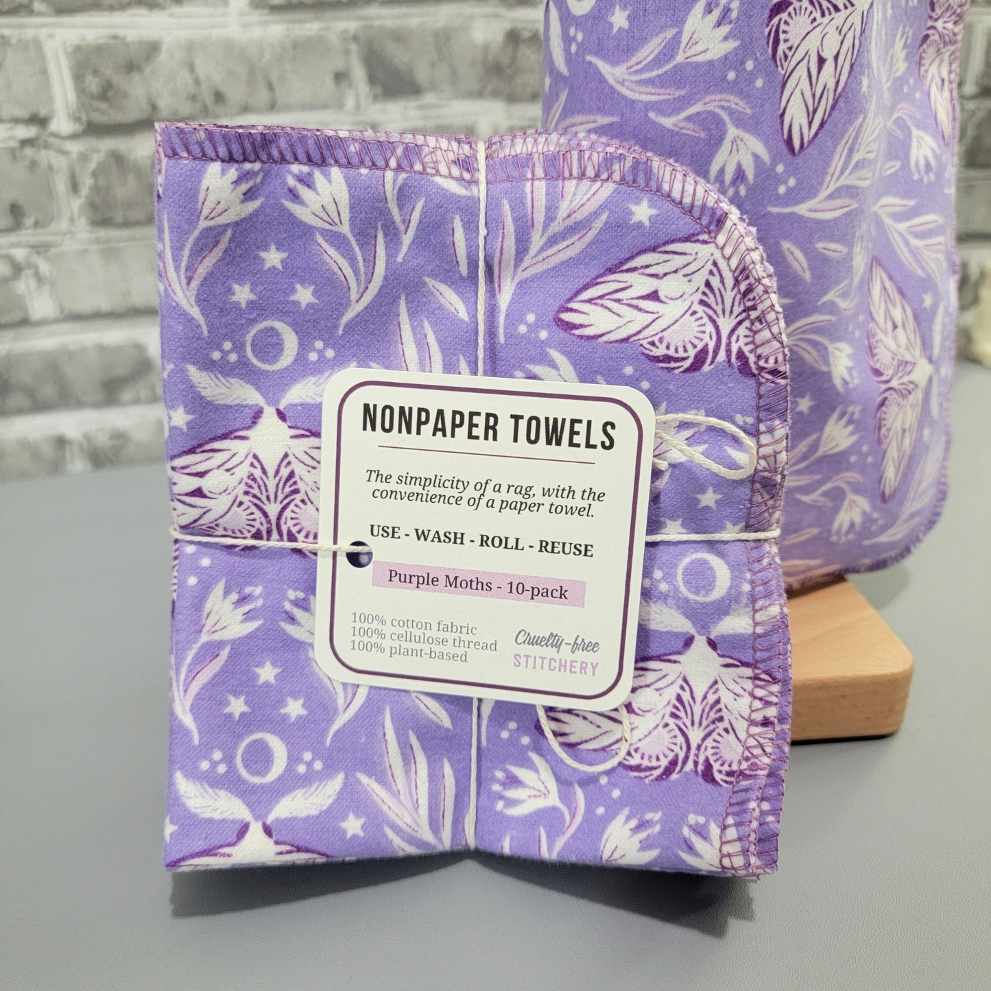 The Purple Moths NonPaper Towels in a bundled pack, tied with string and a small paper tag. NonPaper Towels, the simplicity of a rag with the convenience of a paper towel. Use wash roll reuse. 10 pack