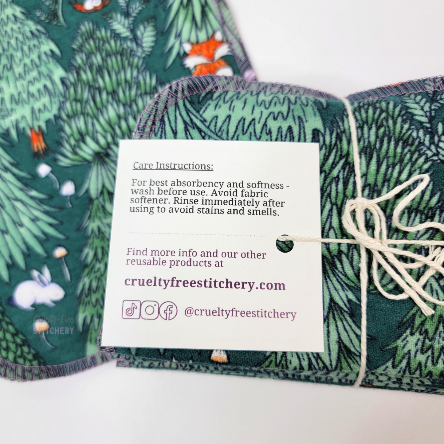 The back of the tag on the bundled pack of cloth wipes. Contains care instructions and info about our shop, which can be found in the item description.