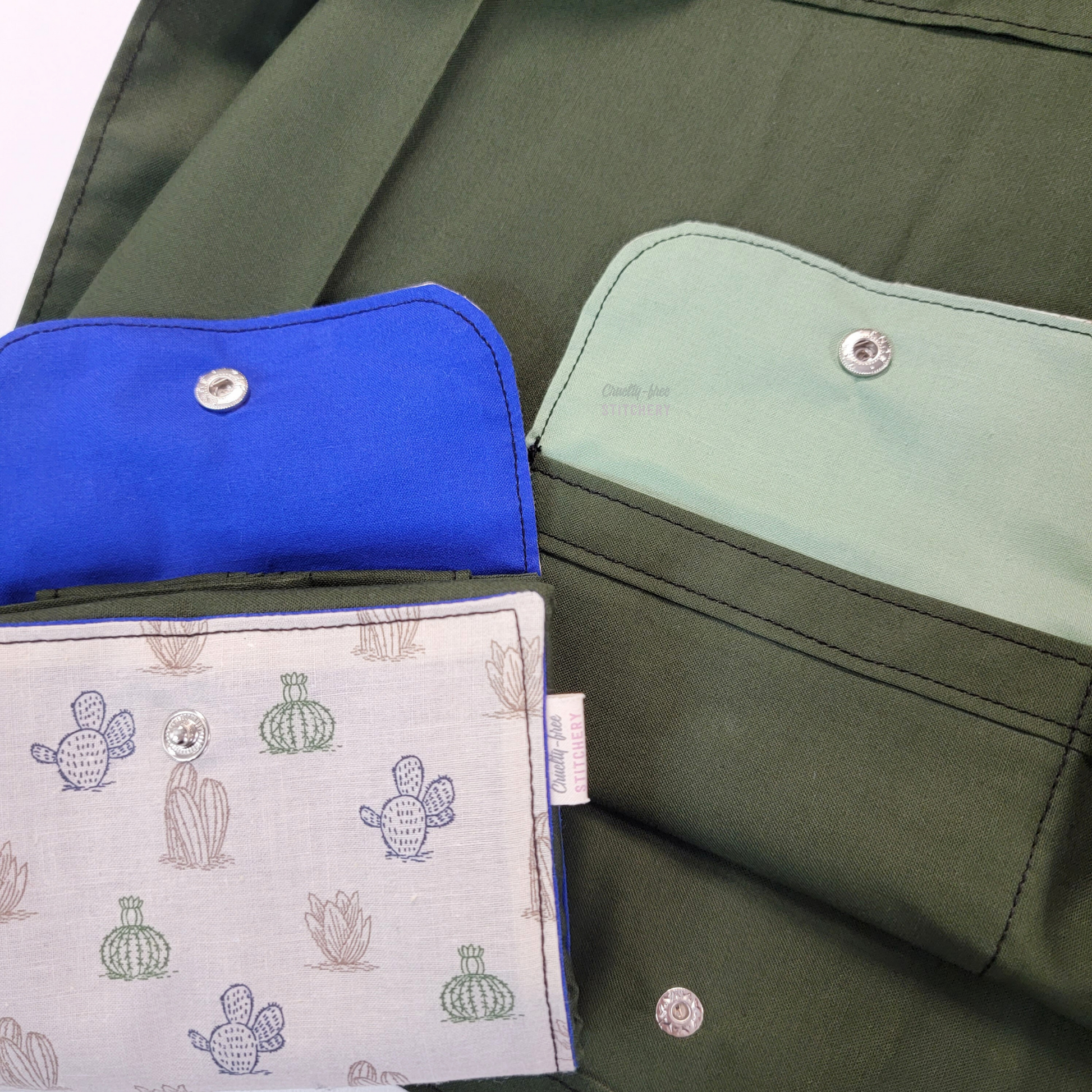 Two inner flaps shown together, one is a bright primary blue, the other is a light sage green - to show that the color inside may vary.