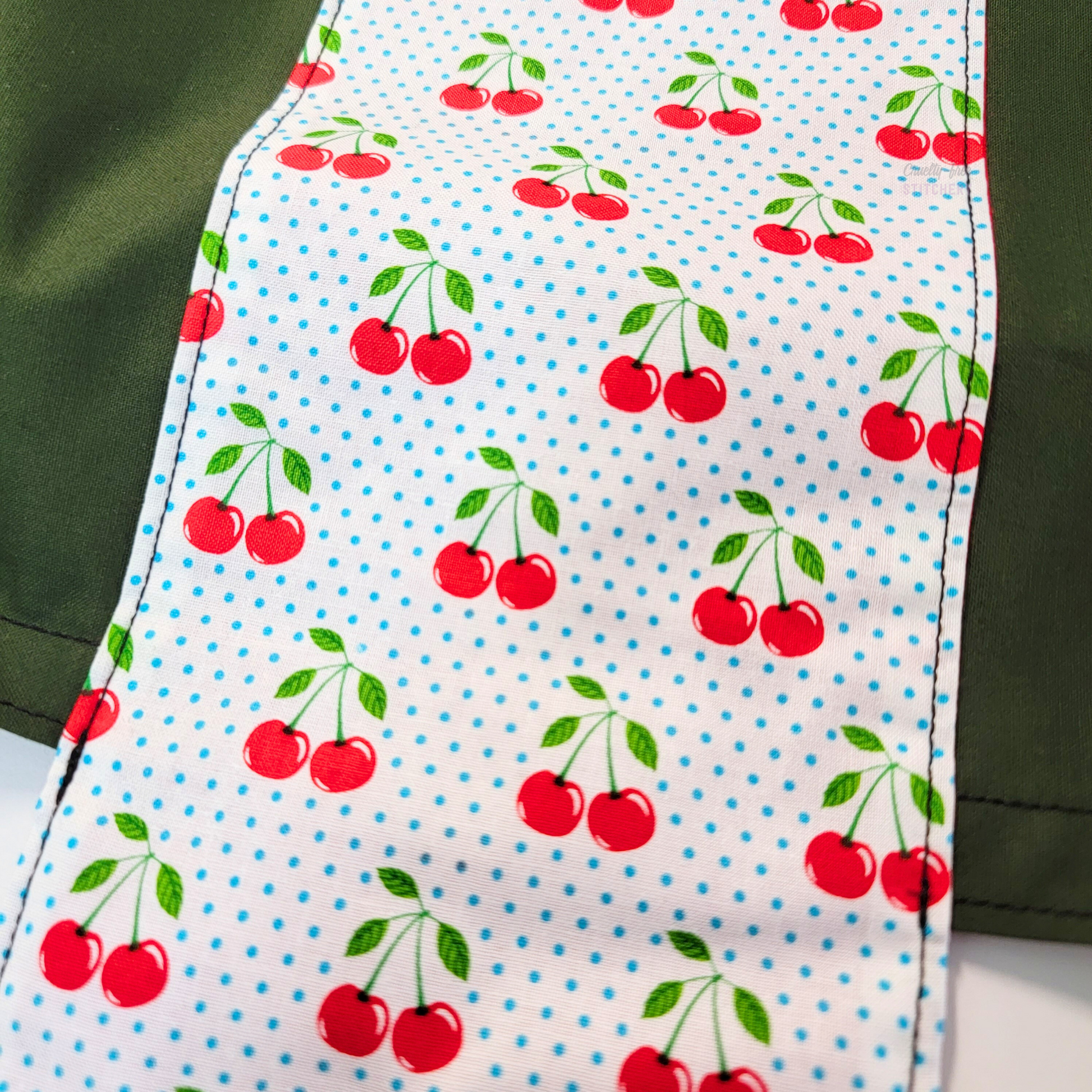 A close-up of the retro-inspired cherry print.