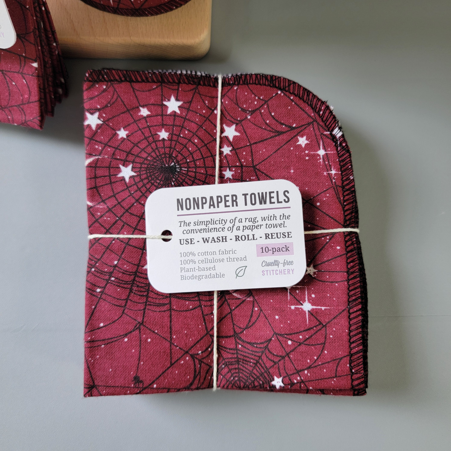 A bundled 10-pack of the red moon web nonpaper towels, close-up. Same tag as the 5-pack, but it of course says 10-pack instead. 