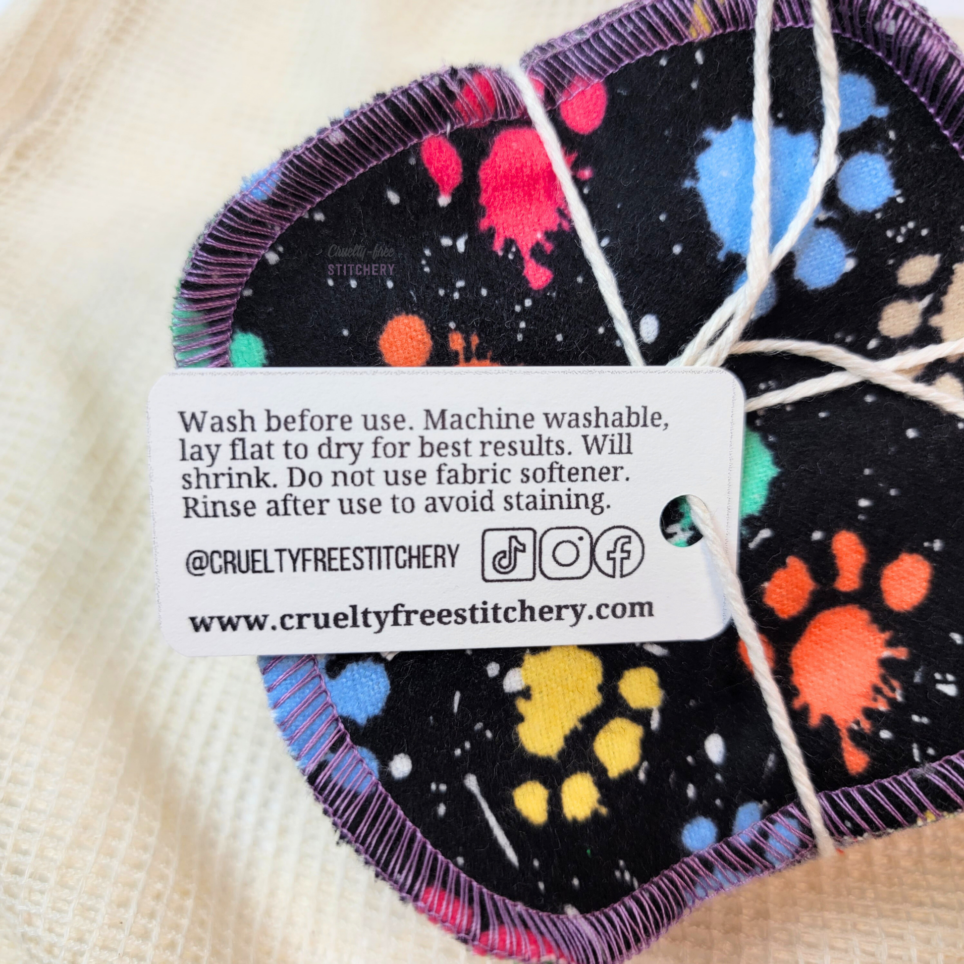 The back side of the small paper tag on the bundled pack of cotton rounds with care instructions - can be found in the item description.