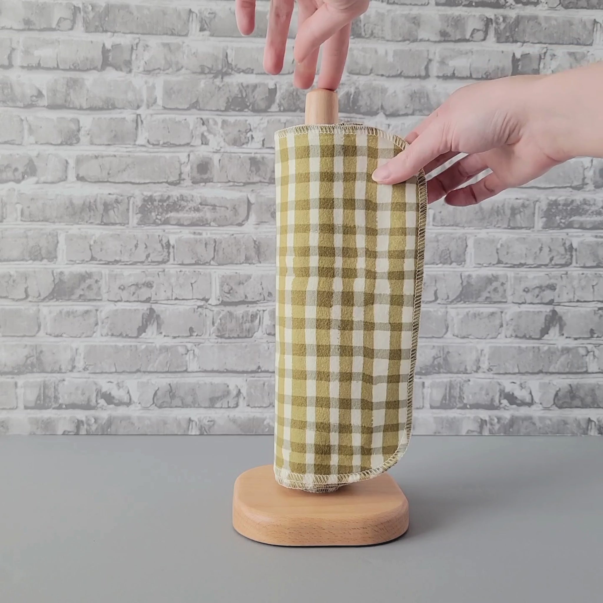 Unrolling an Olive Painted Plaid NonPaper Towel