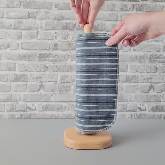 Unrolling a Deep Blue Stripe NonPaper Towel