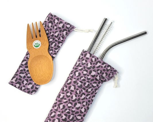 Reusable bamboo spork and stainless steel straw pouch set. The pouches are both a muted violet purple leopard print.