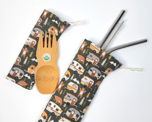 Reusable bamboo spork and stainless steel straw pouch set. The pouches are both dark green with vintage style campers, trees, and bears.